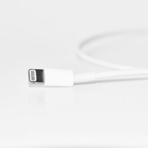 Minimalist close-up of a white charging cable, useful for tech themes.